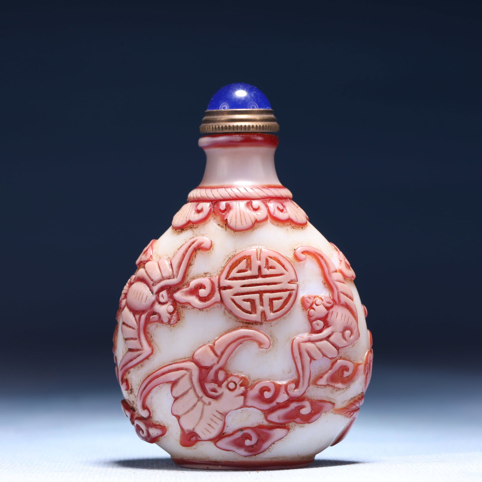An Exquisite Glass Auspicious Cloud and Bats Pattern Snuff Bottle: An Exquisite Glass Auspicious Cloud and Bats Pattern Snuff Bottle,Qing Dynasty,China,Qianlong Four-character Mark,Size:2.4inx1.4inx3.1in,Weight:63g 琉璃祥云蝙蝠 