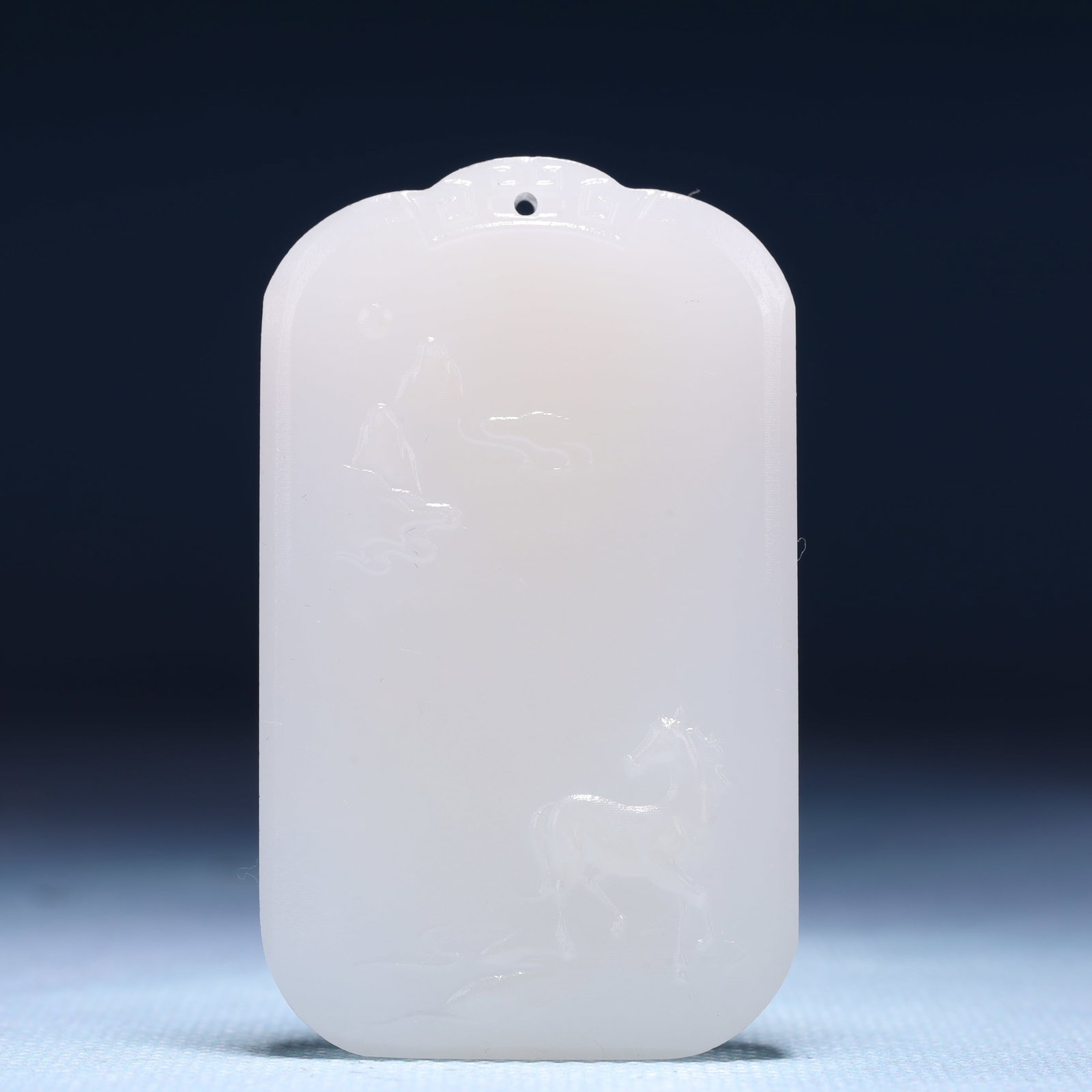 An Exquisite White Jade Horse Pattern Pendant: An Exquisite White Jade Horse Pattern Pendant,Size:1.6inx0.4inx2.4in,Weight:53g 白玉骏马纹牌