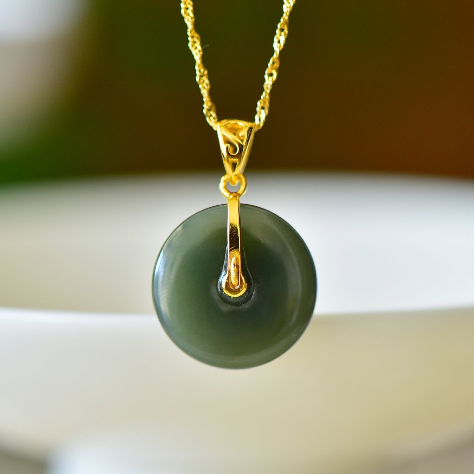 An Exquisite Sterling Silver-Gold Plated Inlaid Greenish Jade Pendant: An Exquisite Sterling Silver-Gold Plated Inlaid Greenish Jade Pendant,Size:0.8inx0.8in 纯银镀金镶青玉吊坠