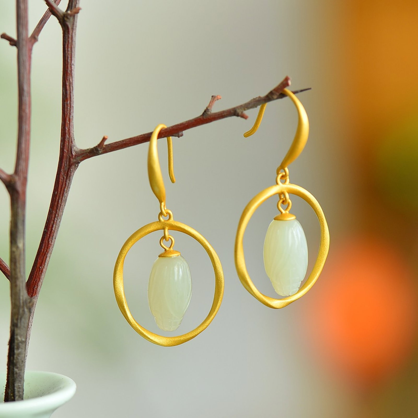 A Pair of Exquisite Sterling Silver-Gold Plated Inlaid White Jade Earrings: A Pair of Exquisite Sterling Silver-Gold Plated Inlaid White Jade Earrings,Size:0.3inx0.7in 一对纯银镀金镶白玉耳环