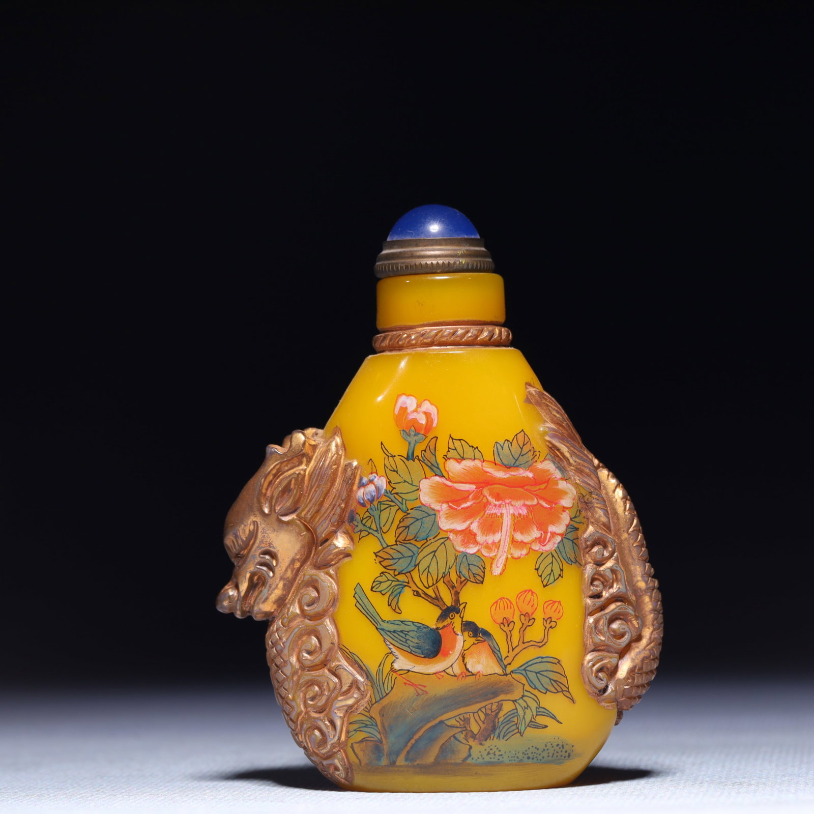 An Exquisite Glass Flower and Bird Pattern Snuff Bottle: An Exquisite Glass Flower and Bird Pattern Snuff Bottle,Qing Dynasty,China,Yongzheng Four-character Mark,Size:2.4inx1.2inx3.1in,Weight:133g 琉璃花鸟纹鼻烟