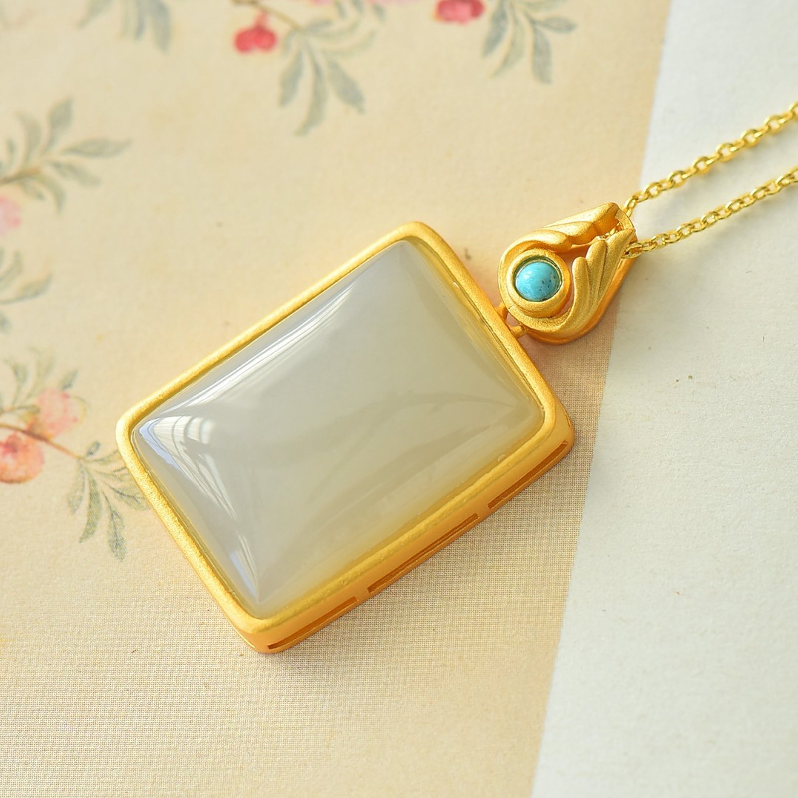 An Exquisite Sterling Silver-Gold Plated Inlaid White Jade Pendant: An Exquisite Sterling Silver-Gold Plated Inlaid White Jade Pendant 纯银镀金镶白玉吊坠
