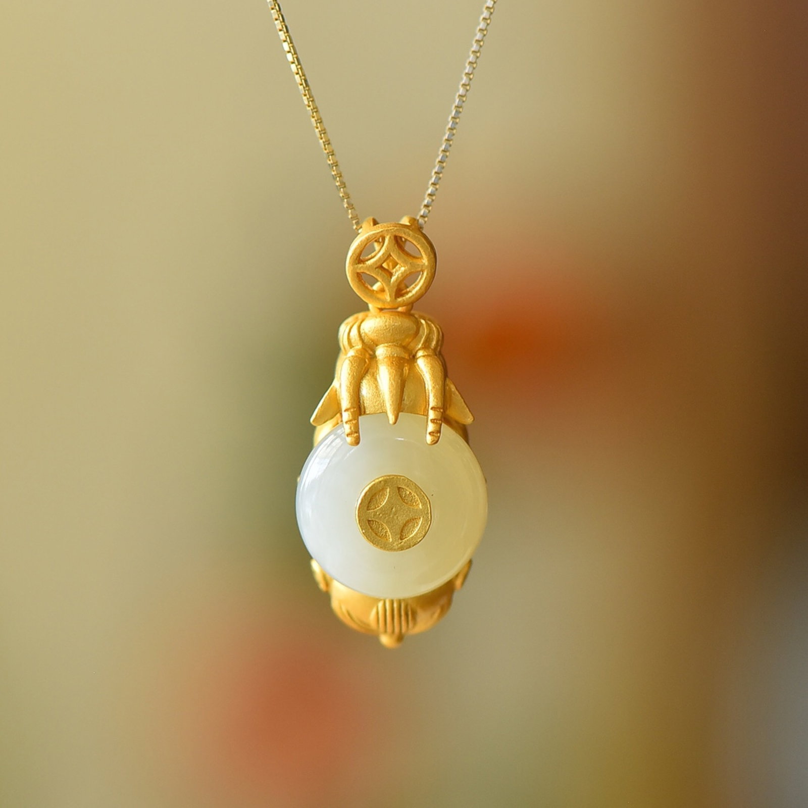 An Exquisite Sterling Silver-Gold Plated Inlaid White Jade Pendant: An Exquisite Sterling Silver-Gold Plated Inlaid White Jade Pendant,Size:0.5inx0.5in 纯银镀金镶白玉吊坠