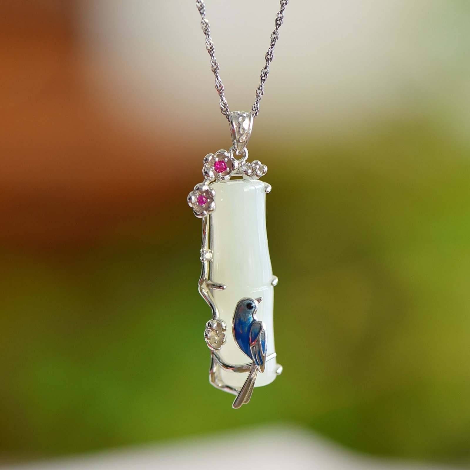 An Exquisite Sterling Silver Inlaid White Jade Enamel Pendant: An Exquisite Sterling Silver Inlaid White Jade Enamel Pendant,Size:0.4inx1.3in 纯银镶白玉珐琅吊坠