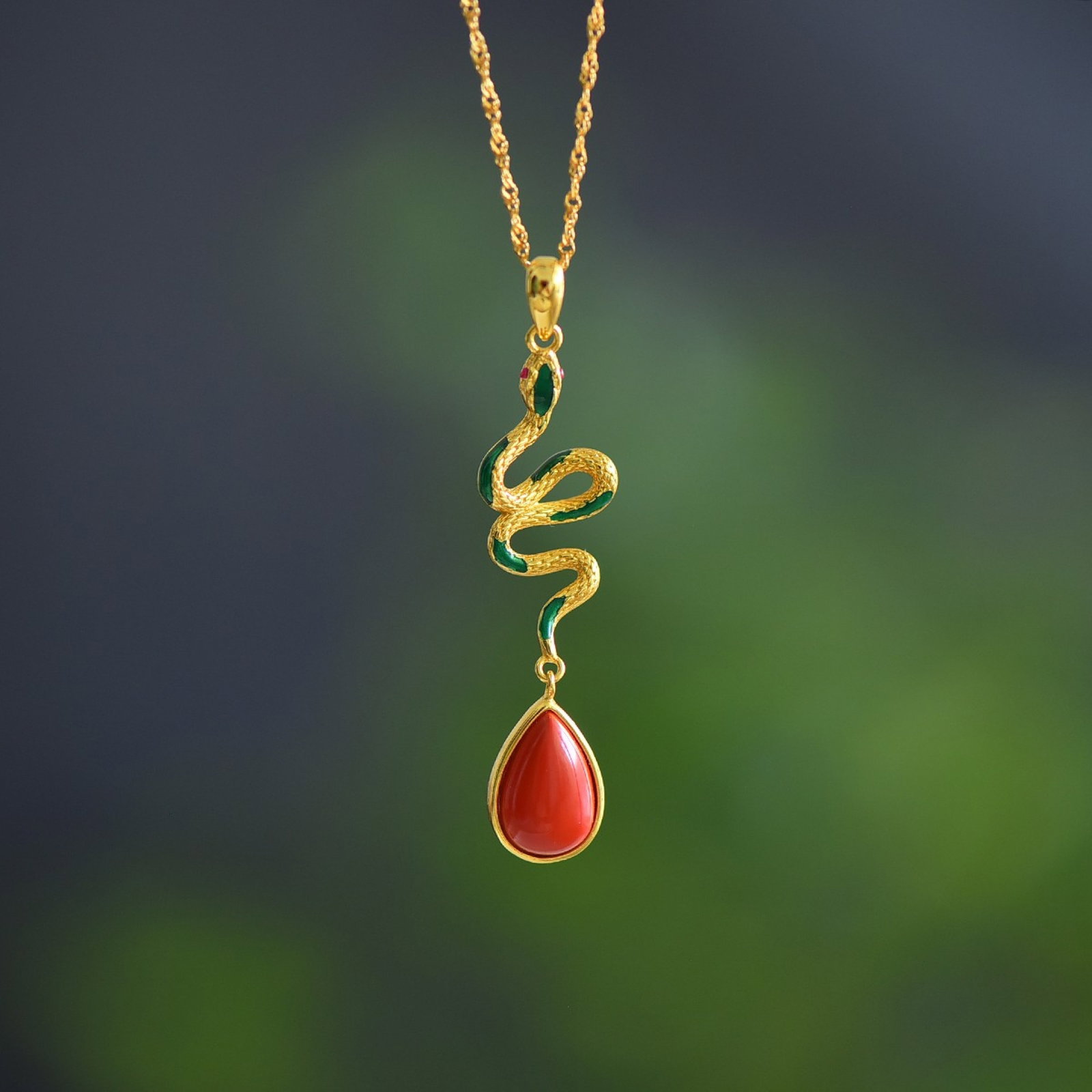 An Exquisite Sterling Silver-Gold Plated Inlaid Cinnabar Pendant: An Exquisite Sterling Silver-Gold Plated Inlaid Cinnabar Pendant,Size:0.3inx0.5in 寓意:��蛇来运转