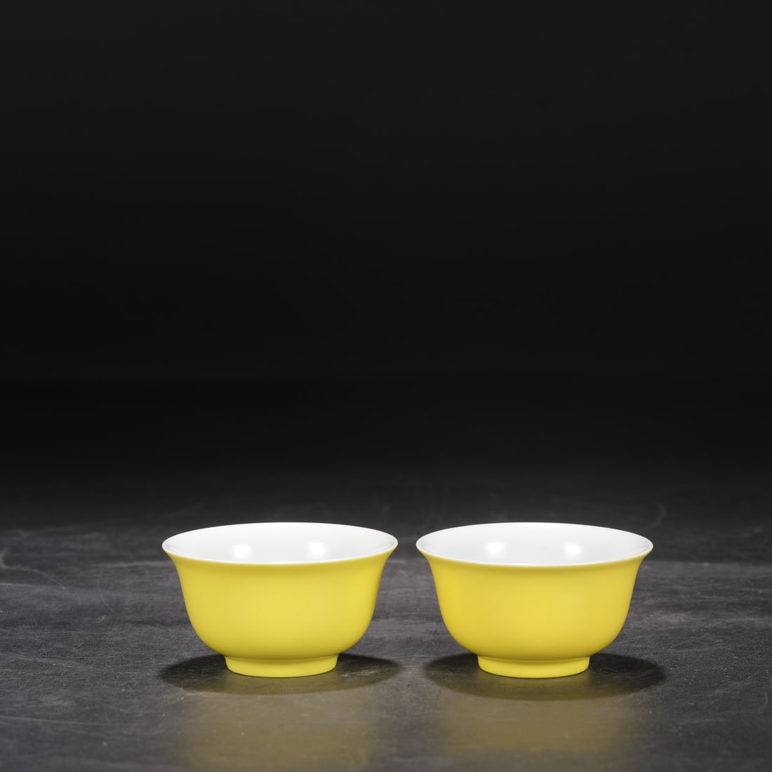 A Pair of Exquisite Yellow Glazed Bowl: A Pair of Exquisite Yellow Glazed Bowl Qing Dynasty, China Yongzheng Six-character Mark Size:1.8inx3.3in黄釉茶盏一对 中国清代 大଀