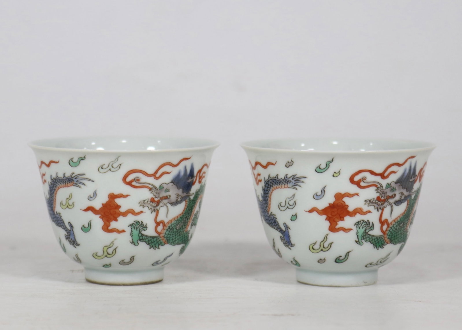 A Pair of Exquisite Blue and White Wucai Dragon Pattern Cups (1 of 9)