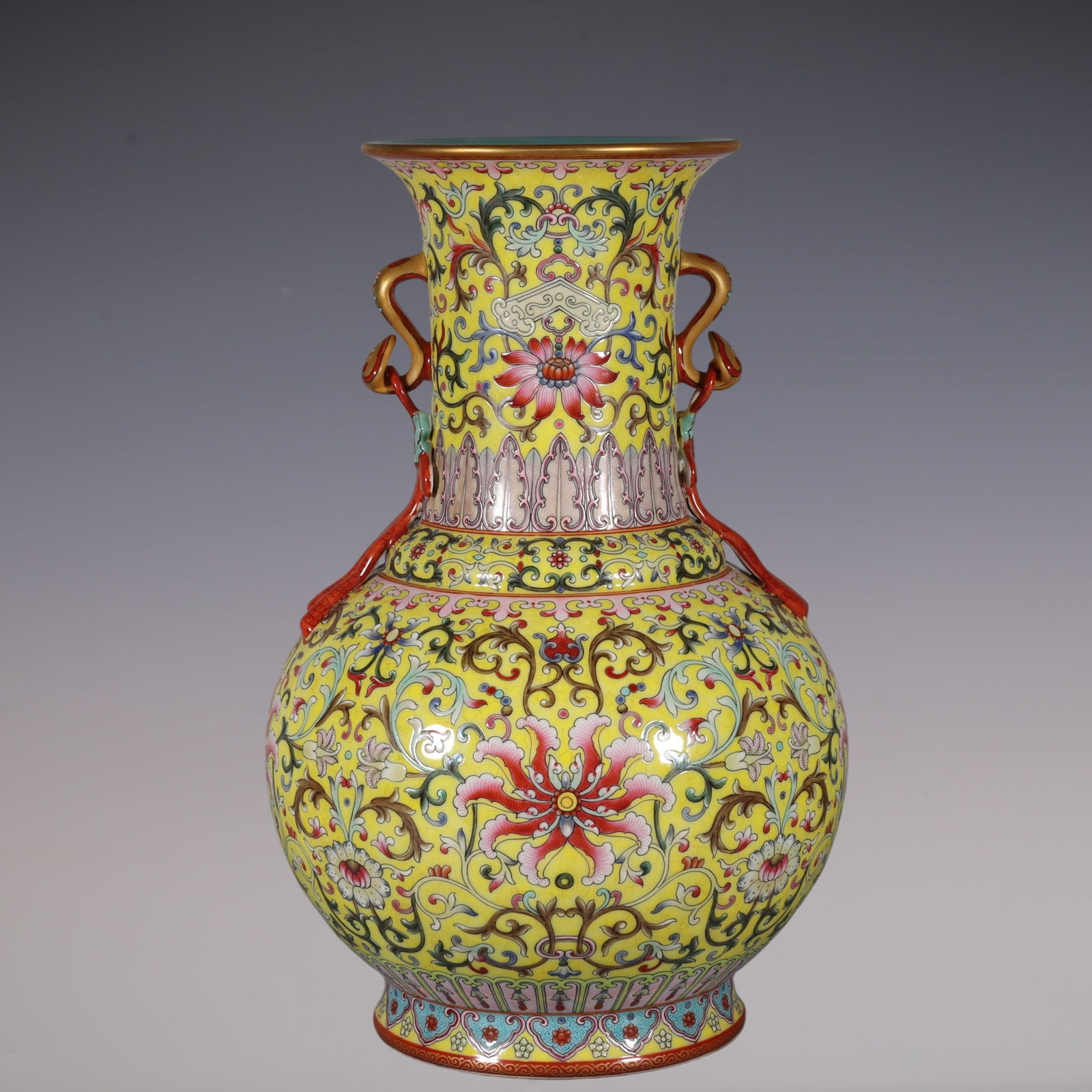 An Exquisite Famille-Rose Lotus Pattern Double-Ears Vase: An Exquisite Famille-Rose Lotus Pattern Double-Ears Vase Qing Dynasty, China Qianlong Six-character Mark Size:14.4inx5.7in粉彩黄地缠枝莲如玉ࡡ