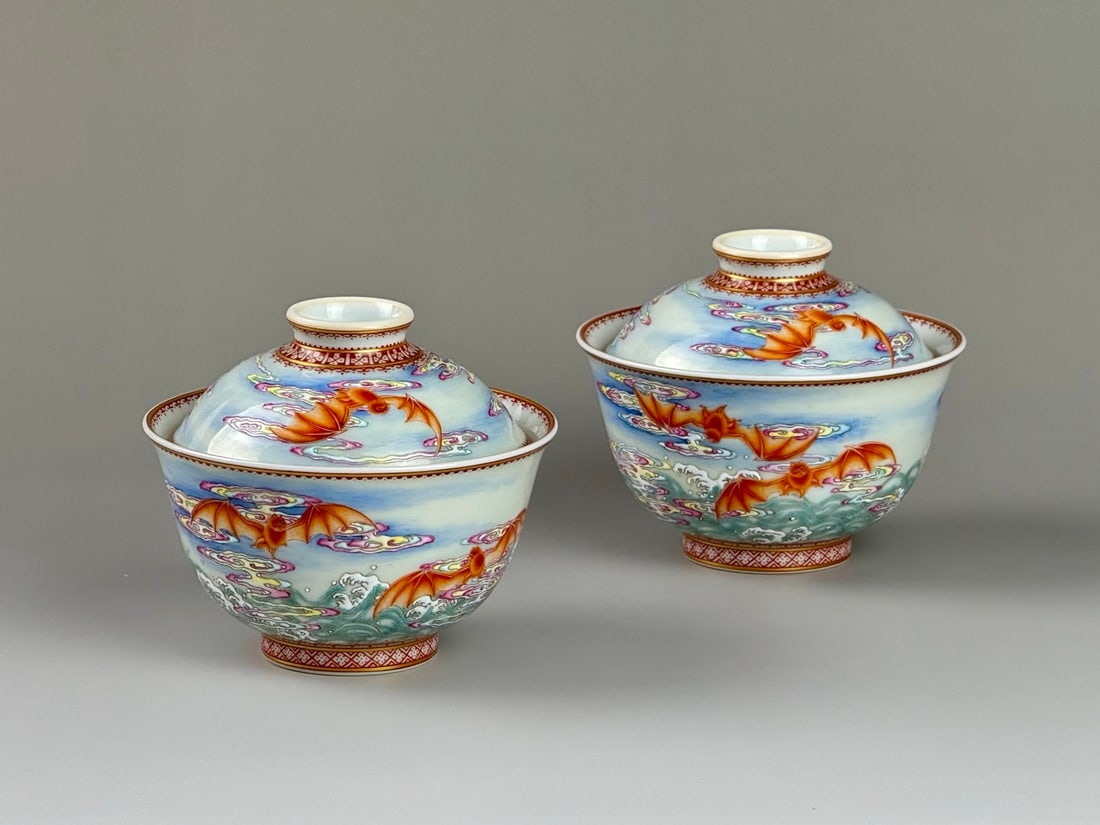 A Pair of Exquisite Iron-Red Glazed Famille-Rose Painted Gold Seawater,Auspicious Cloud and Bats: A Pair of Exquisite Iron-Red Glazed Famille-Rose Painted Gold Seawater,Auspicious Cloud and Bats Pattern Cover Bowls,Qing Dynasty,China,Yongzheng Six-character Mark,Size:3.7inx3.1inx1.6in一ë