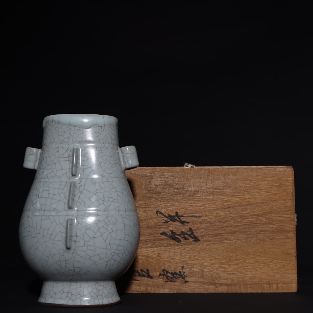 An Exquisite Guan yao Celadon Glazed Double-Ears Vase: An Exquisite Guan yao Celadon Glazed Double-Ears Vase Song Dynasty, China Size:7.3inx4.7in官窑青釉贯耳瓶 中国宋代 Size:18.5cmx12cm