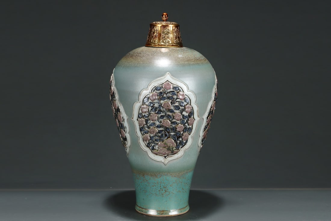 An Exquisite Flambe Glazed Lotus Pattern Vase: An Exquisite Flambe Glazed Lotus Pattern Vase Yuan Dynasty, China Size:19.5inx10.4in窑变釉浮雕开窗缠枝莲梅瓶