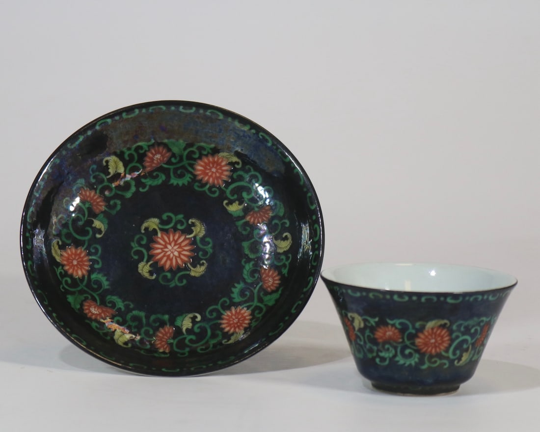 An Exquisite Black Ground Famille-Rose Lotus Pattern Cup,With Tray: An Exquisite Black Ground Famille-Rose Lotus Pattern Cup,With Tray,Qing Dynasty,China,Qianlong Four-character Mark,Size:(Cup)2.7inx1.5in,(Plate)4.4in黑地粉彩缠枝
