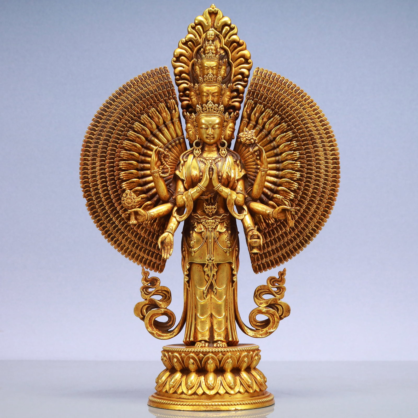 An Exquisite Gilt Bronze Statue of Thousand-hand Guanyin: An Exquisite Gilt Bronze Statue of Thousand-hand Guanyin Ming Dynasty, China Yongle Six-character Mark Size:8.7inx3.9inx13.4in Weight:4100g铜鎏金千手观音Ë