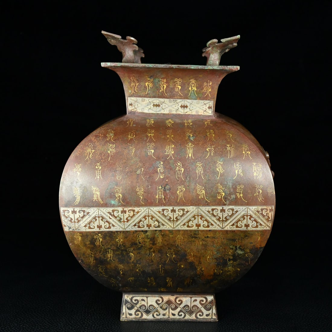 An Archaic Bronze Inlaid Gold and Silver Beast-Ears Vase,With Bird Seal Script: An Archaic Bronze Inlaid Gold and Silver Beast-Ears Vase,With Bird Seal Script,Qing Dynasty, China,Size:9.8inx7.1in,Weight:2700g青铜错金银兽耳瓶,带