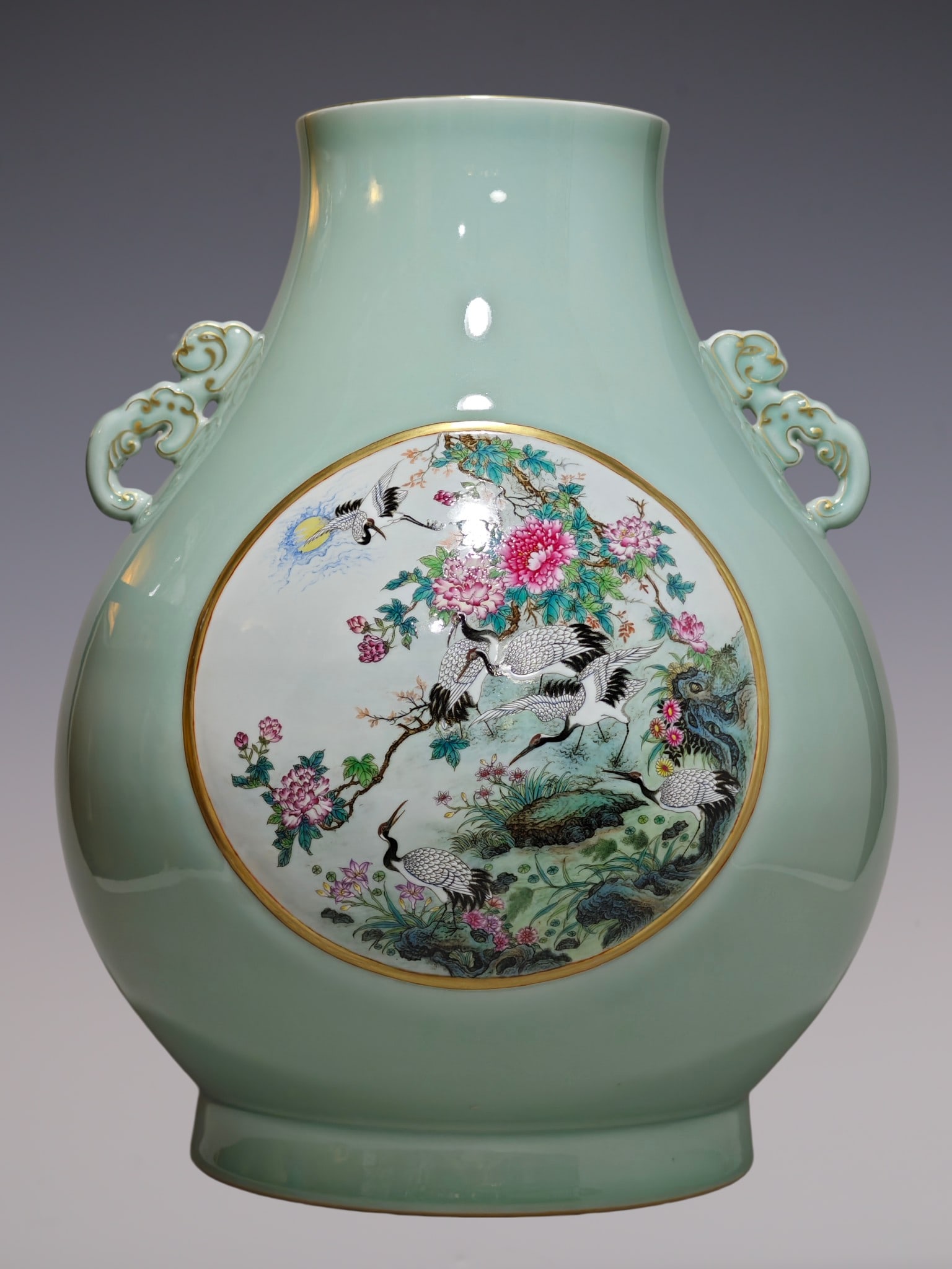 An Exquisite Famille-Rose Celadon Glazed Flower and Bird Pattern Double-Ears Vase: An Exquisite Famille-Rose Celadon Glazed Flower and Bird Pattern Double-Ears Vase Qing Dynasty, China Qianlong Six-character Mark Size:19.1inx15in豆青釉开窗六࿖