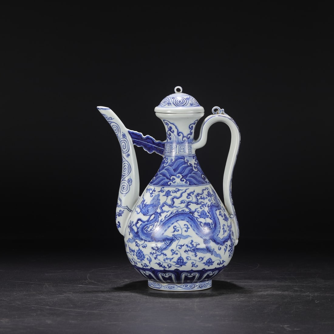 An Exquisite Blue and White Lotus Pattern Seawater Pattern Dragon Pattern Ewer: An Exquisite Blue and White Lotus Pattern Seawater Pattern Dragon Pattern Ewer Ming Dynasty, China Size:12.6inx6.7in青花缠枝海水龙纹大执