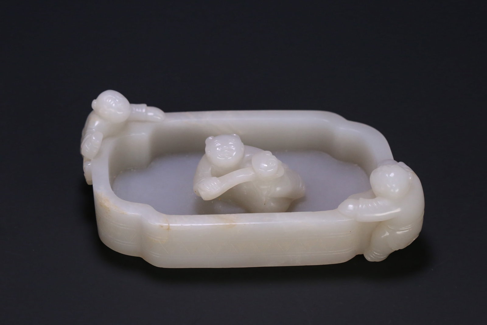 An Exquisite White Jade Figure Pattern Brush Washer: An Exquisite White Jade Figure Pattern Brush Washer,Qing Dynasty, ChinaSize:5inx2.8inx1.6in,Weight:304.6g白玉人物纹笔洗,中国清代,Size: