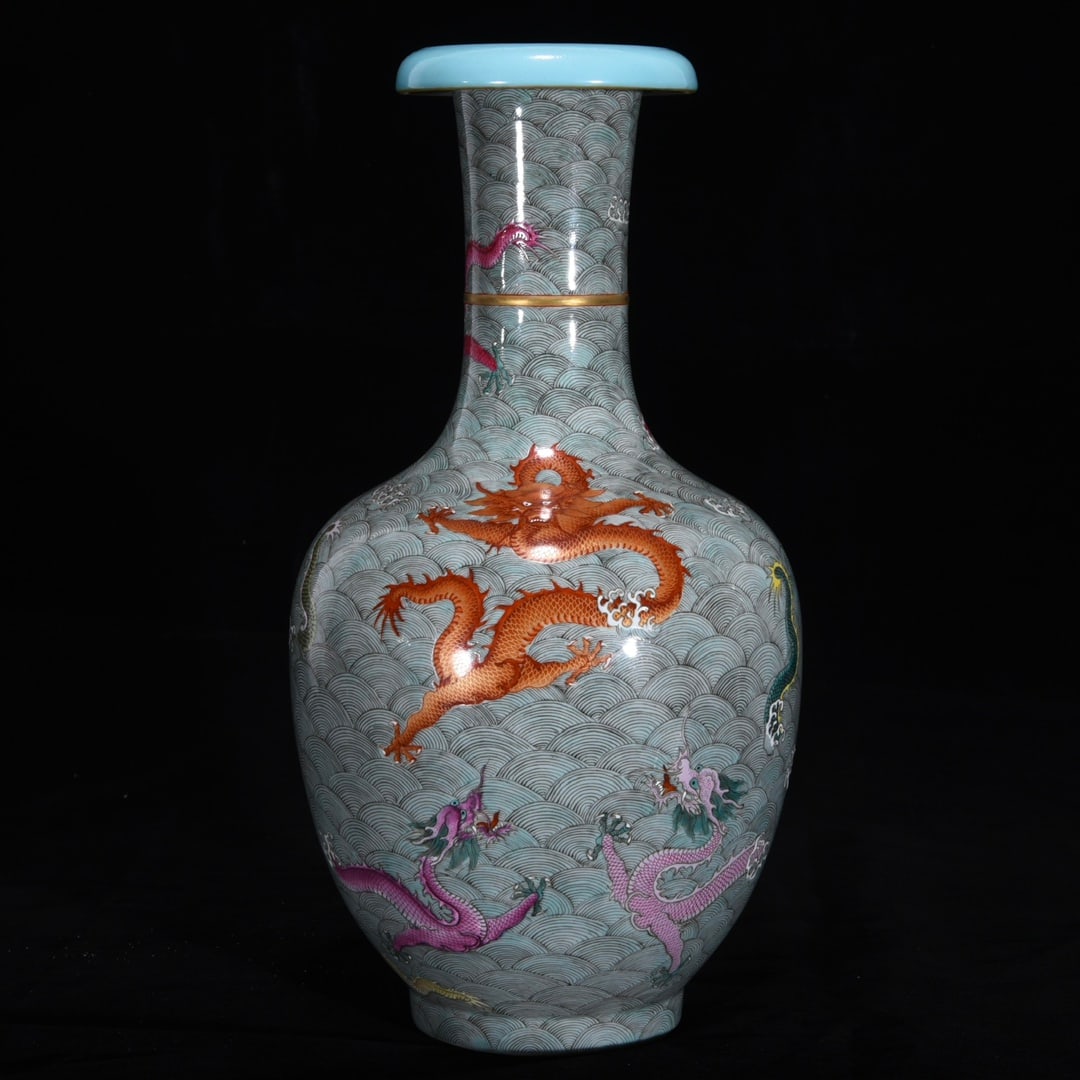 An Exquisite Famille-Rose Seawater Pattern Dragon Pattern Vase: An Exquisite Famille-Rose Seawater Pattern Dragon Pattern Vase Qing Dynasty, China Qianlong Six-character Mark Size:12.8inx6.7in粉彩海水九龙反口瓶