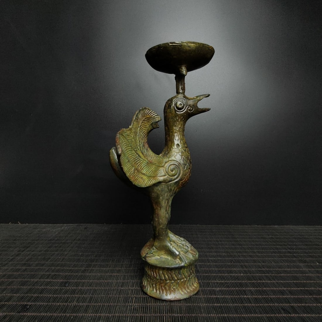 An Archaic Bronze Bird-Shaped Candlestick: An Archaic Bronze Bird-Shaped Candlestick,the Warring States period in China,Size:10.2inx7.9in,Weight:1200g青铜鸟形烛台,中国战国时