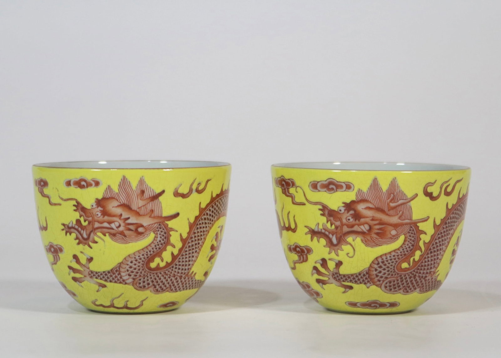 A Pair of Exquisite Yellow Ground Iron-Red Color Auspicious Cloud and Dragon Pattern Cups: A Pair of Exquisite Yellow Ground Iron-Red Color Auspicious Cloud and Dragon Pattern Cups,Qing Dynasty,China,Qianlong Four-character