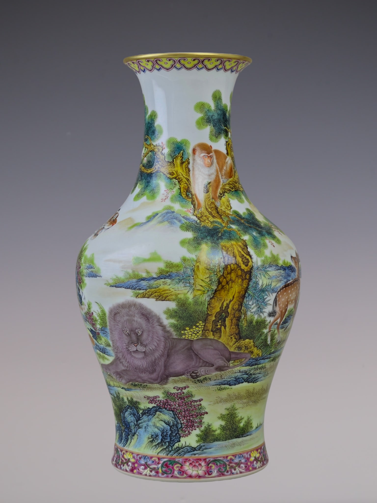 An Exquisite Famille-Rose Animal Pattern Lotus Pattern Vase: An Exquisite Famille-Rose Animal Pattern Lotus Pattern Vase Qing Dynasty, China Qianlong Six-character Mark Size:13inx7.9in粉彩虎鹿狮猴纹鱼尾ī
