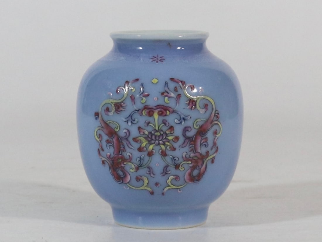 An Exquisite Sky Blue Glazed Famille-Rose Lotus and Dragon Pattern Jar: An Exquisite Sky Blue Glazed Famille-Rose Lotus and Dragon Pattern Jar,Qing Dynasty,China,Yongzheng Six-character Mark,Size:3.3inx1.7in天蓝釉粉彩缠枝莲&