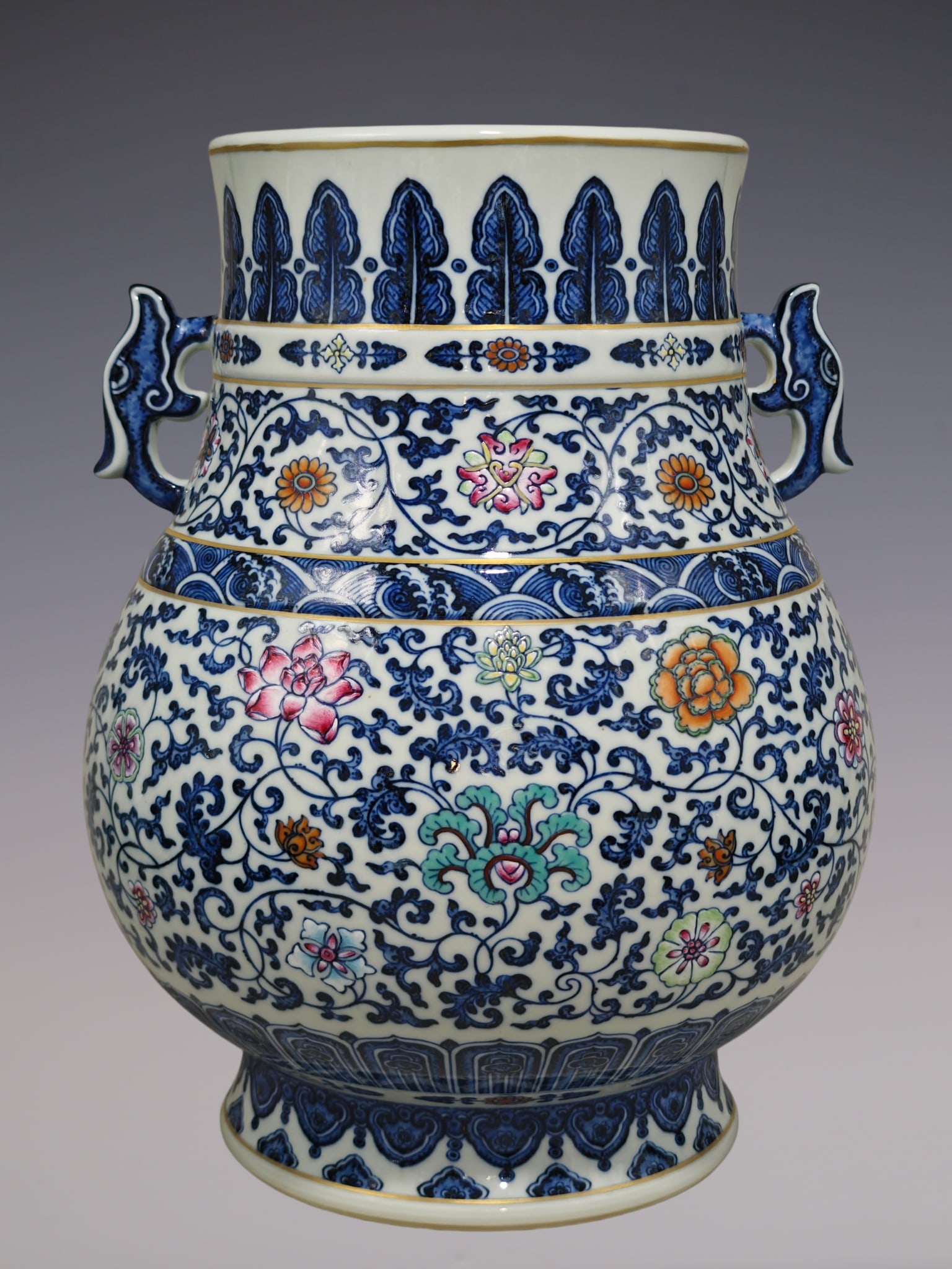An Exquisite Doucai Blue and White Lotus Pattern Double-Ears Vase: An Exquisite Doucai Blue and White Lotus Pattern Double-Ears Vase Qing Dynasty, China Qianlong Six-character Mark Size:15inx11.8in青花缠枝莲斗粉彩ࡡ