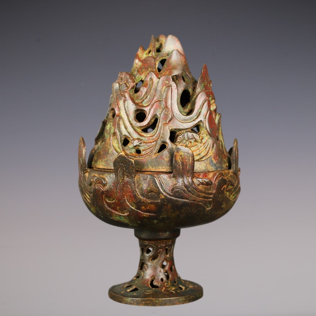 An Archaic Bronze Hollow Censer: An Archaic Bronze Hollow Censer,Han Dynasty,China,Size:6.3inx10.2in,Weight:1900g青铜镂空香炉,中国汉代,Size:16cmx26cm,Weight:1900g