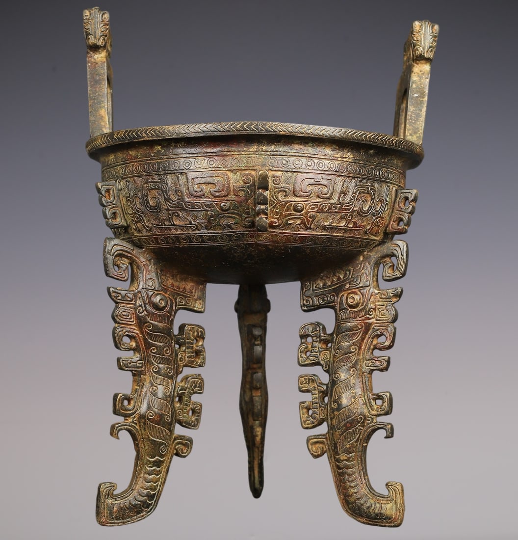 An Archaic Bronze Beast-Face Pattern Double-Ears and Tripod Censer: An Archaic Bronze Beast-Face Pattern Double-Ears and Tripod Censer,Han Dynasty,China,Size:8.3inx11.8in,Weight:3050g青铜兽面纹双耳三足香Ġ
