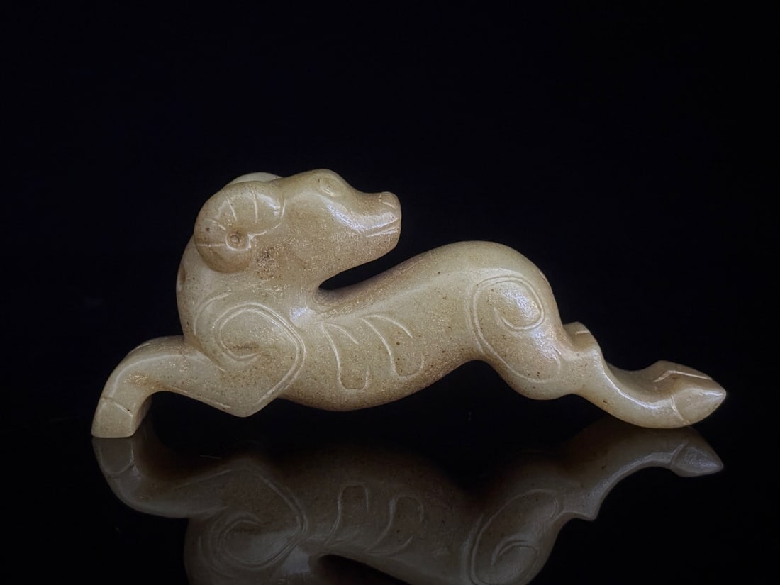 An Exquisite White Jade Auspicious Beast Pendant: An Exquisite White Jade Auspicious Beast Pendant,the Sang and Zhou in Period in