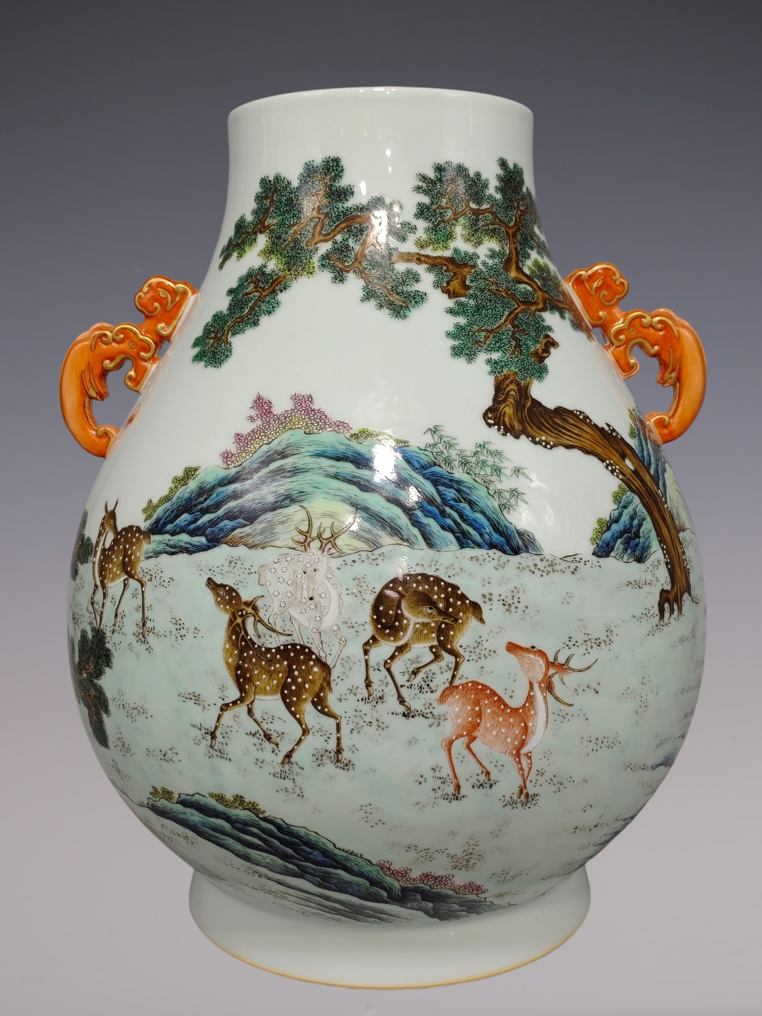 An Exquisite Famille-Rose Pine Pattern Deer Pattern Double-Ears Vase: An Exquisite Famille-Rose Pine Pattern Deer Pattern Double-Ears Vase Qing Dynasty, China Qianlong Six-character Mark Size:18.1inx14.6in粉彩十鹿尊