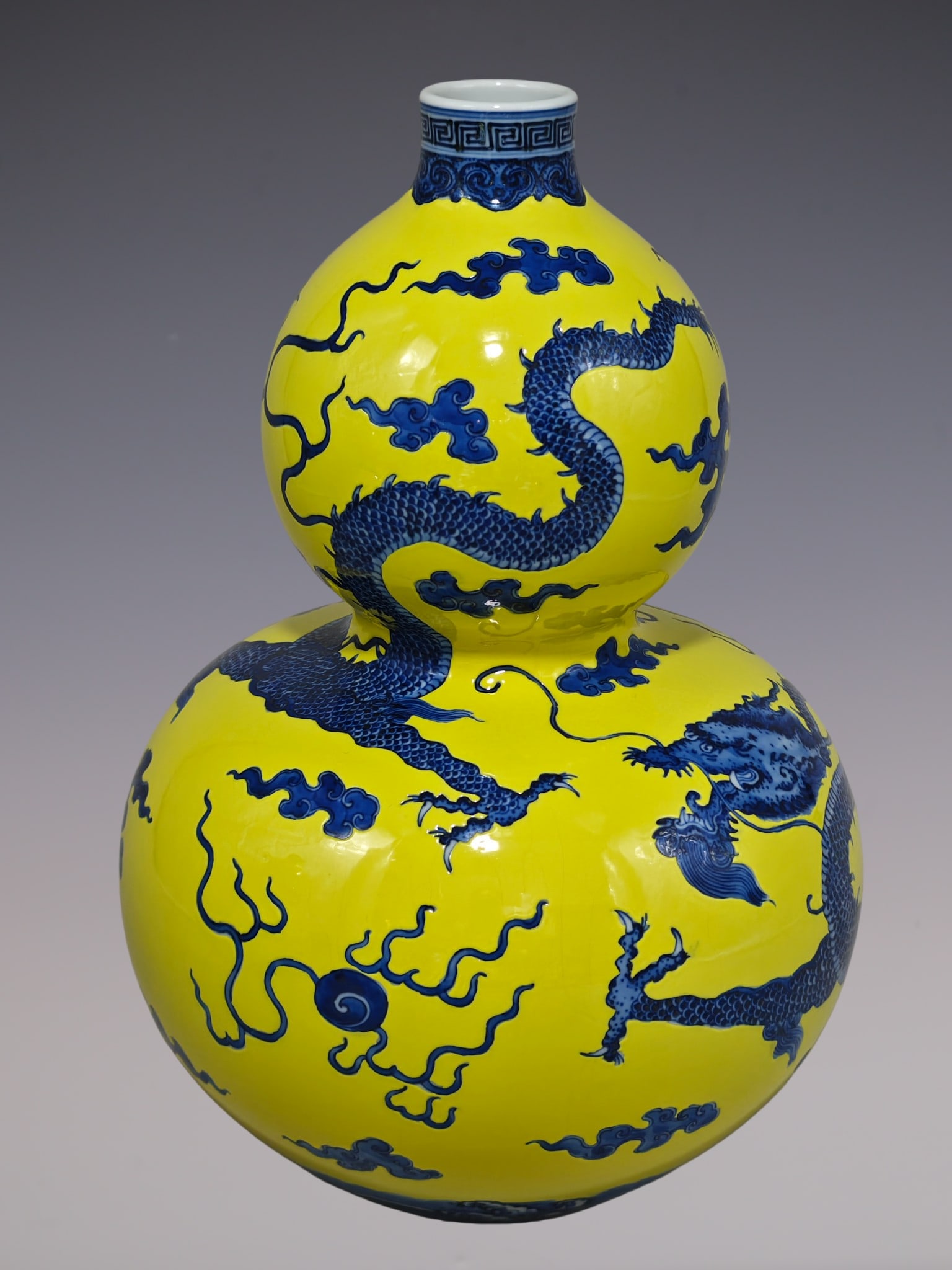 An Exquisite Blue and White Dragon Pattern Seawater Pattern Gourd-Shaped Vase: An Exquisite Blue and White Dragon Pattern Seawater Pattern Gourd-Shaped Vase Qing Dynasty, China Qianlong Six-character Mark Size:12.2inx7.9in黄底青花龙纹戏&