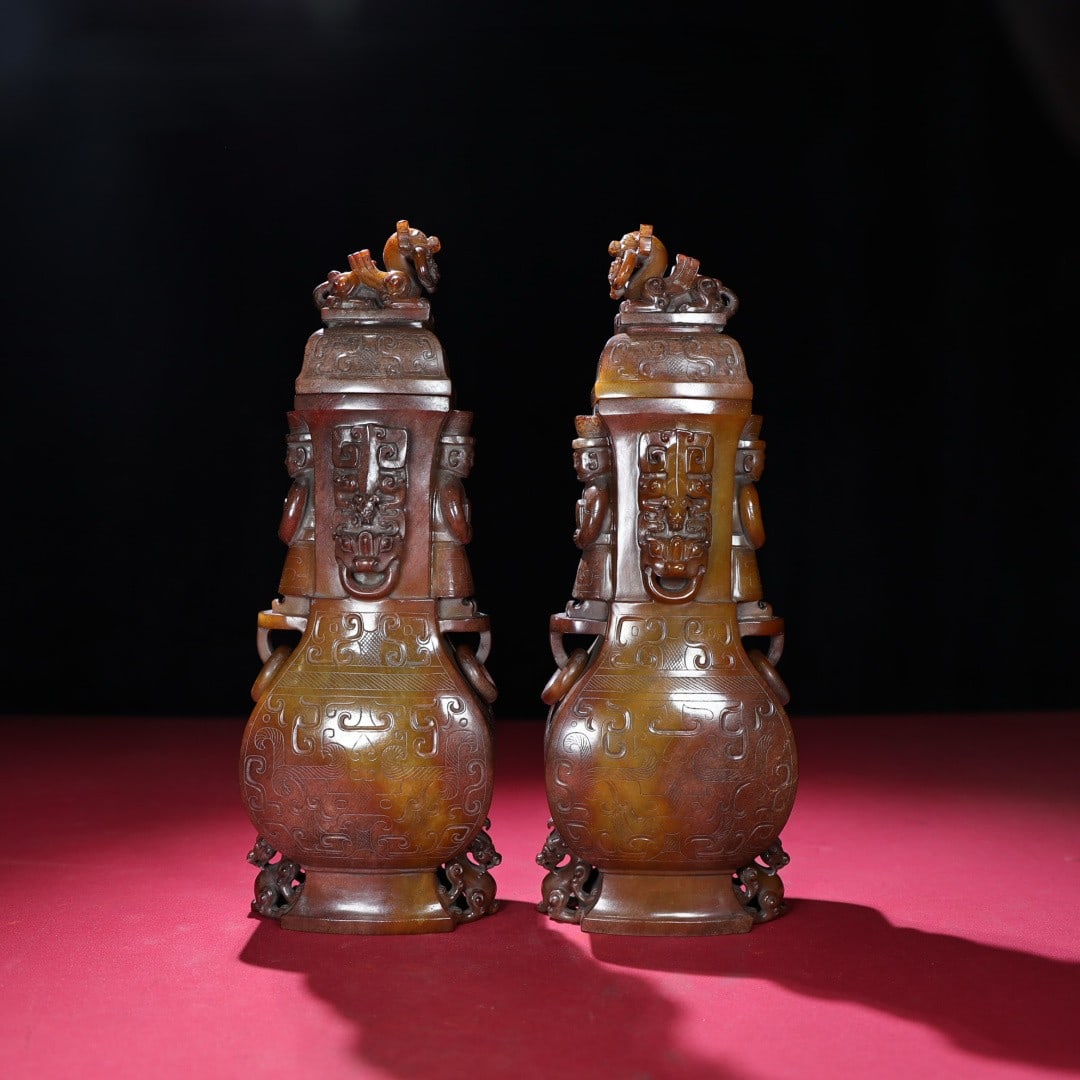A Pair of Exquisite White Jade Beast-Face Pattern Figure-Ears Bottles: A Pair of Exquisite White Jade Beast-Face Pattern Figure-Ears Bottles,Qing Dynasty,China,Size:10.9inx3.9inx2.7in,Weight:2899g一对白玉兽面纹人耳