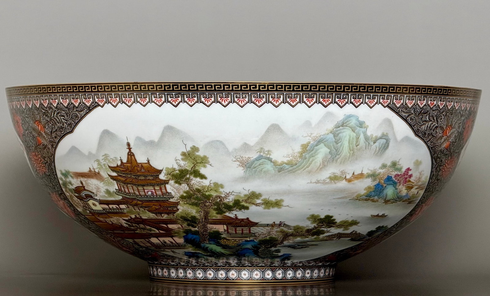 A Rare Ink Color Famille-Rose Painted Gold Landscape and Figure Pattern Bowl,With Poem: A Rare Ink Color Famille-Rose Painted Gold Landscape and Figure Pattern Bowl,With Poem,Qing Dynasty,China,Qianlong Six-character Mark,Size:14.5inx5.8inx5.6in墨彩粉彩描