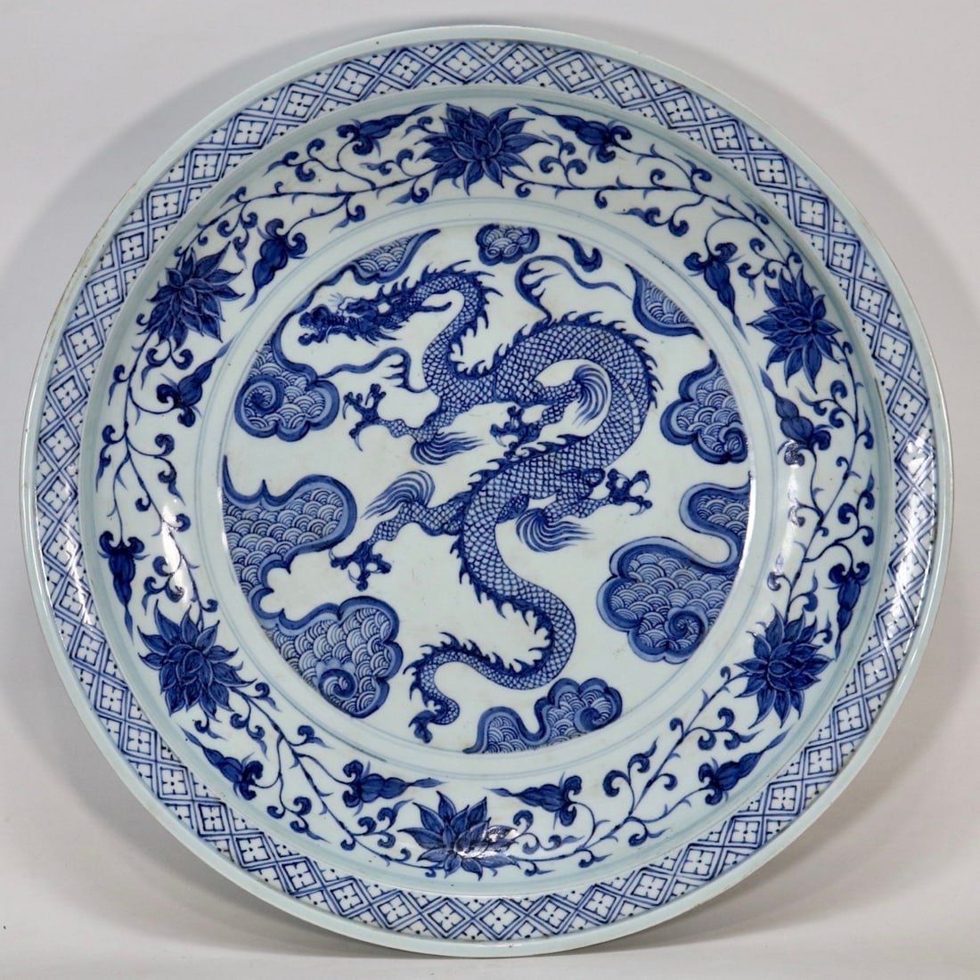 A Huge Blue and White Lotus and Seawater and Dragon Pattern Plate: A Huge Blue and White Lotus and Seawater and Dragon Pattern Plate,Qing Dynasty,China,Size:18in青花缠枝莲海水龙纹盘,中国清&