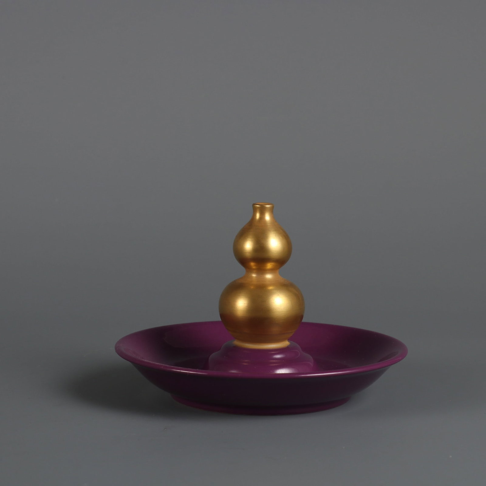 An Exquisite Purple Glazed Painted Gold Candlestick: An Exquisite Purple Glazed Painted Gold Candlestick Qing Dynasty, China Yongzheng Four-character MarkSize:3inx4.2in紫釉描金烛台 中国清代 