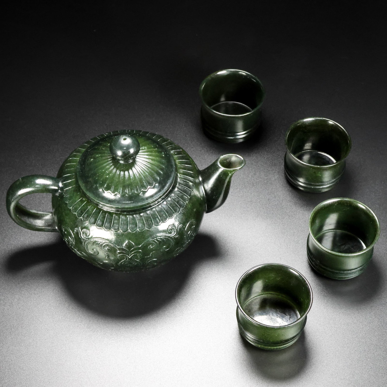 A Set of Fine Jasper Lotus Pattern Teaware: A Set of Fine Jasper Lotus Pattern Teaware,Qing Dynasty,China,Qianlong Four-character Mark,Size:(Ewer)6.7inx4.3in,(Cup)1.4inx2in,Total Weight:345g一套碧玉缠枝ഫ