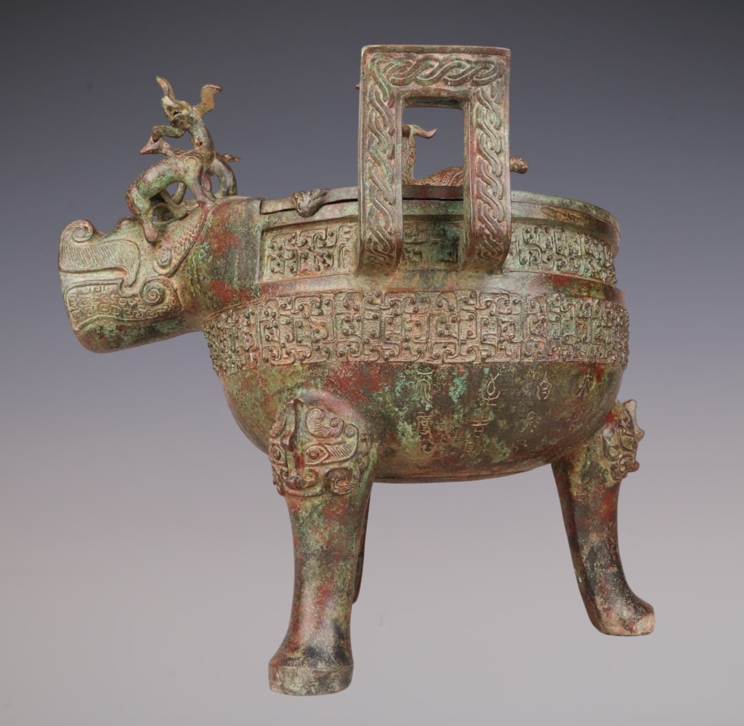 An Archaic Bronze Beast-head Double-Ears and Tripod Cup,With Inscription: An Archaic Bronze Beast-head Double-Ears and Tripod Cup,With Inscription,W.Zhou ,China,Size:16.5inx16.1inx16.5in,Weight:10000g青铜兽首双耳三足杯,&