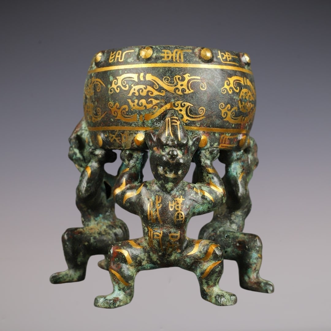 An Archaic Bronze Inlaid Gold Figure-Shaped Ornament: An Archaic Bronze Inlaid Gold Figure-Shaped Ornament,Han Dynasty,China,Size:5.9inx6.9in,Weight:2150g青铜错金人形摆件,中国汉代,Si