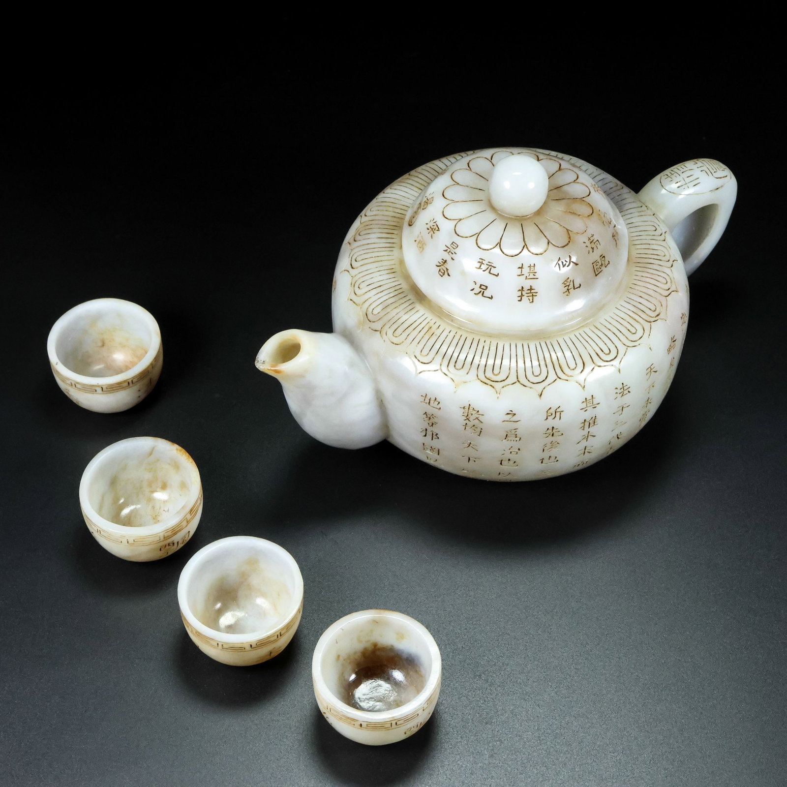 A Set of Fine White Jade Poem Teaware: A Set of Fine White Jade Poem Teaware,Qing Dynasty,China,Qianlong Four-character Mark,Size:(Ewer)4.7inx7.5inx4.7in,(Cup)1.1inx1.6in,Total Weight:711g一套白玉诗文