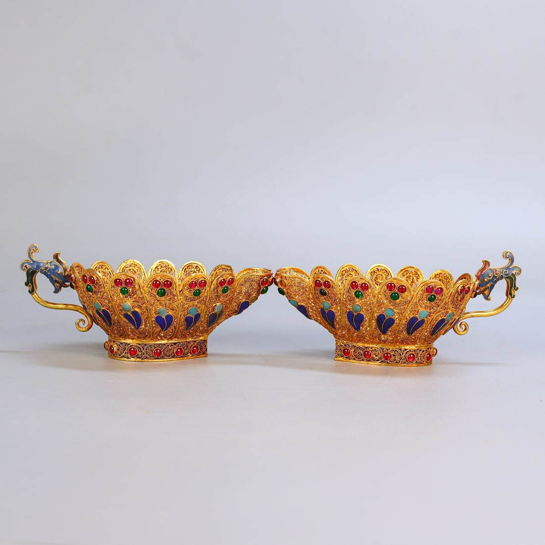 A Pair of Exquisite Filigree and Gilding Inlaid Gems Dragon-head Cups: A Pair of Exquisite Filigree and Gilding Inlaid Gems Dragon-head Cups,Qing Dynasty,China,Qianlong Four-character Mark,Size:3inx5.9in,Weight:371g一对花丝鎏金镶