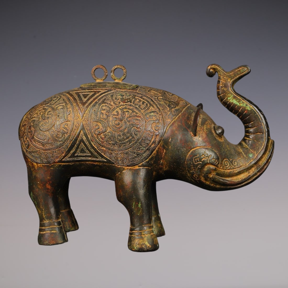 An Archaic Bronze Phoenix Pattern Elephant-Shaped Vase: An Archaic Bronze Phoenix Pattern Elephant-Shaped Vase,W.Zhou ,China,Size:16.1inx11in,Weight:6350g青铜凤纹象形瓶,中国西周时ć