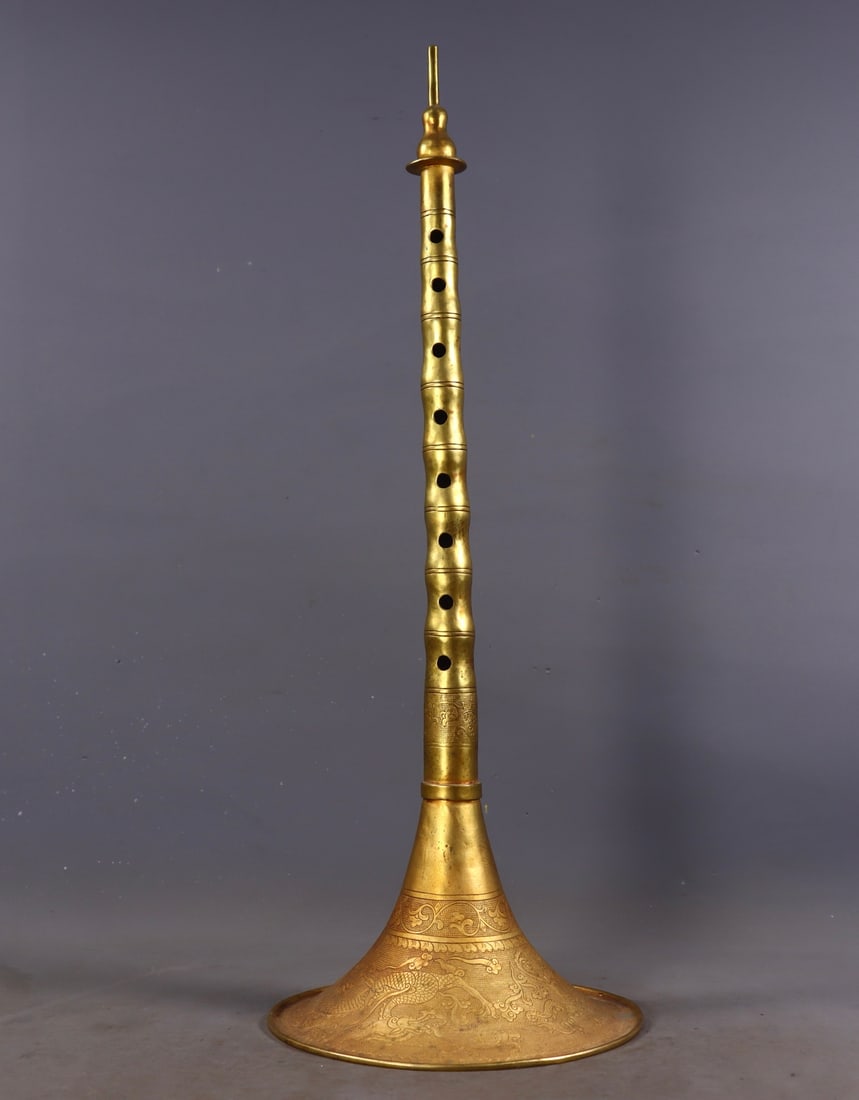A Huge Gilt Bronze Auspicious Cloud and Dragon Pattern Suona: A Huge Gilt Bronze Auspicious Cloud and Dragon Pattern Suona ,Qing Dynasty,China,Qianlong Four-character Mark,Size:18.5inx6.9in,Weight:596g铜鎏金祥云龙纹Ù