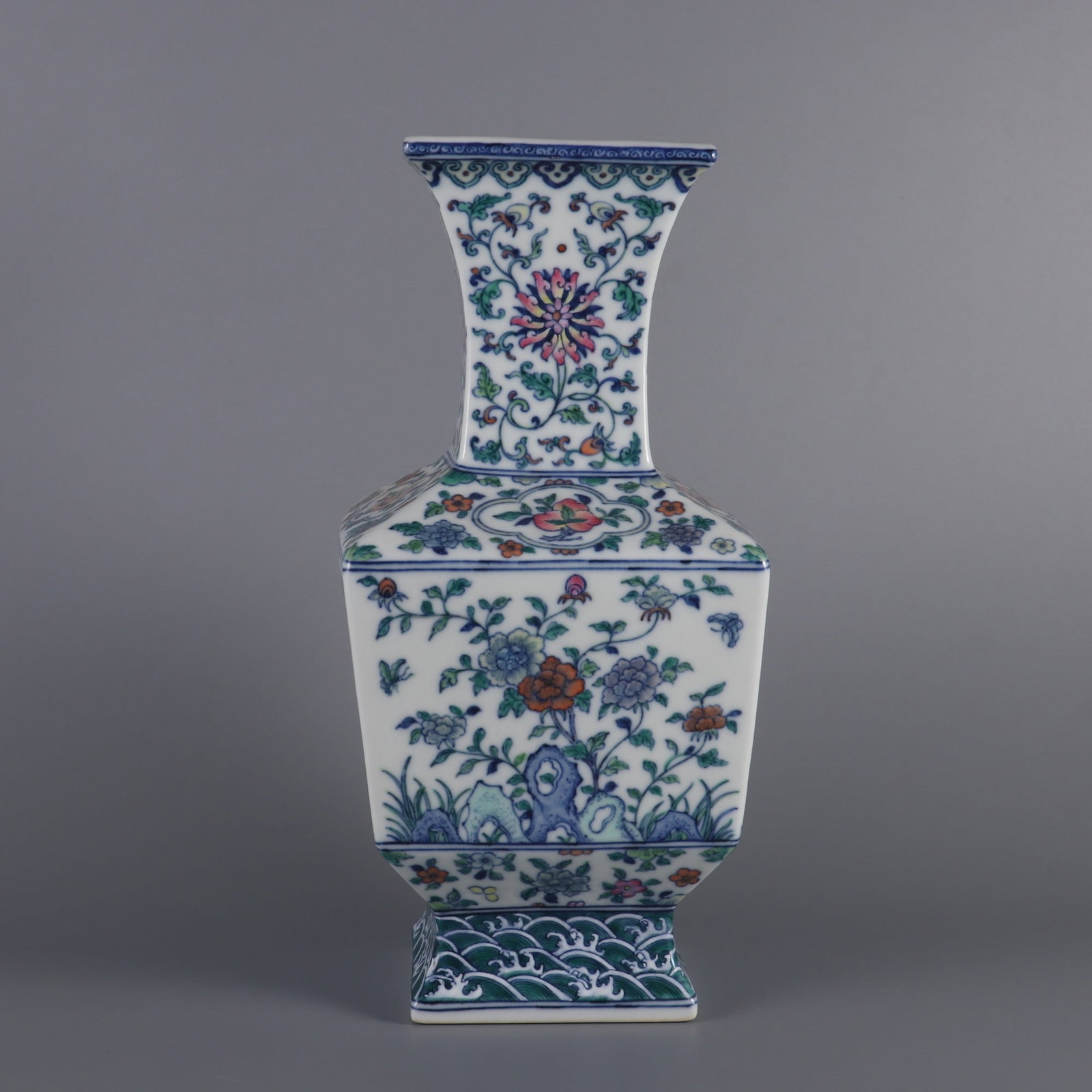 An Exquisite Doucai Lotus Pattern Seawater Pattern Vase: An Exquisite Doucai Lotus Pattern Seawater Pattern Vase Qing Dynasty, China Qianlong Six-character MarkSize:11.7inx5.5in斗彩缠枝莲纹海水纹瓶
