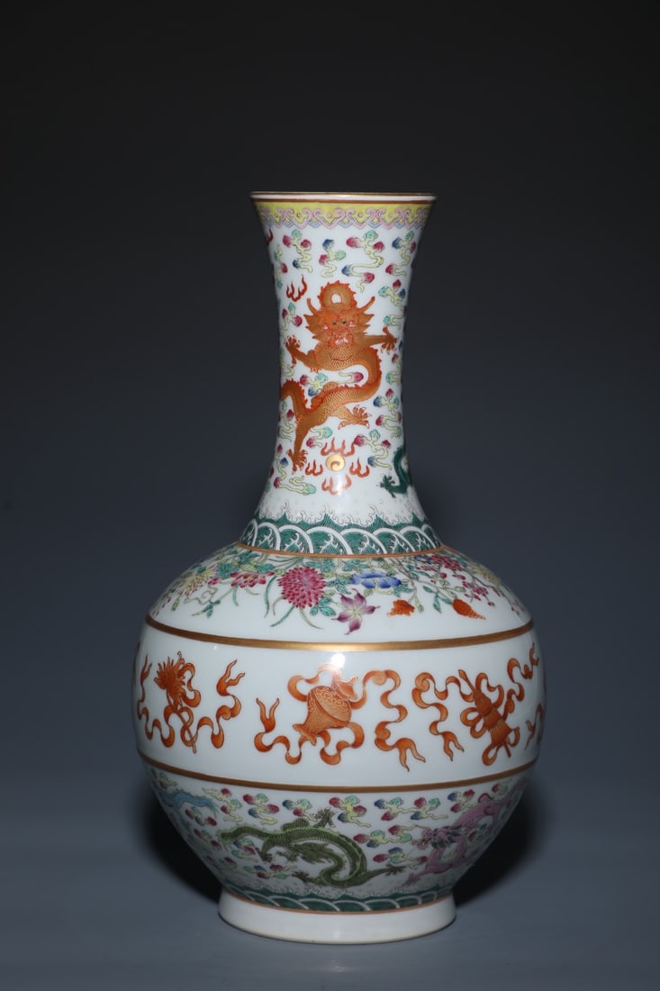 An Exquisite Famille-Rose Eight Treasures Pattern Dragon Pattern Seawater Pattern Vase: An Exquisite Famille-Rose Eight Treasures Pattern Dragon Pattern Seawater Pattern Vase Qing Dynasty, China Qianlong Six-character Mark Size:14.4inx7.9in粉彩八宝龙纹