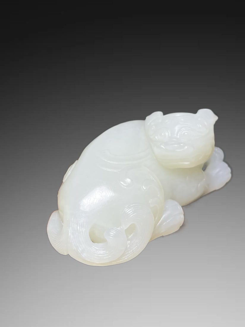 An Exquisite Hotan Jade Auspicious Beast Handheld Carving: An Exquisite Hotan Jade Auspicious Beast Handheld Carving,Qing Dynasty, China,Size:3inx1.2inx1.7in,Weight:138g 和田玉瑞兽手把件,中国清