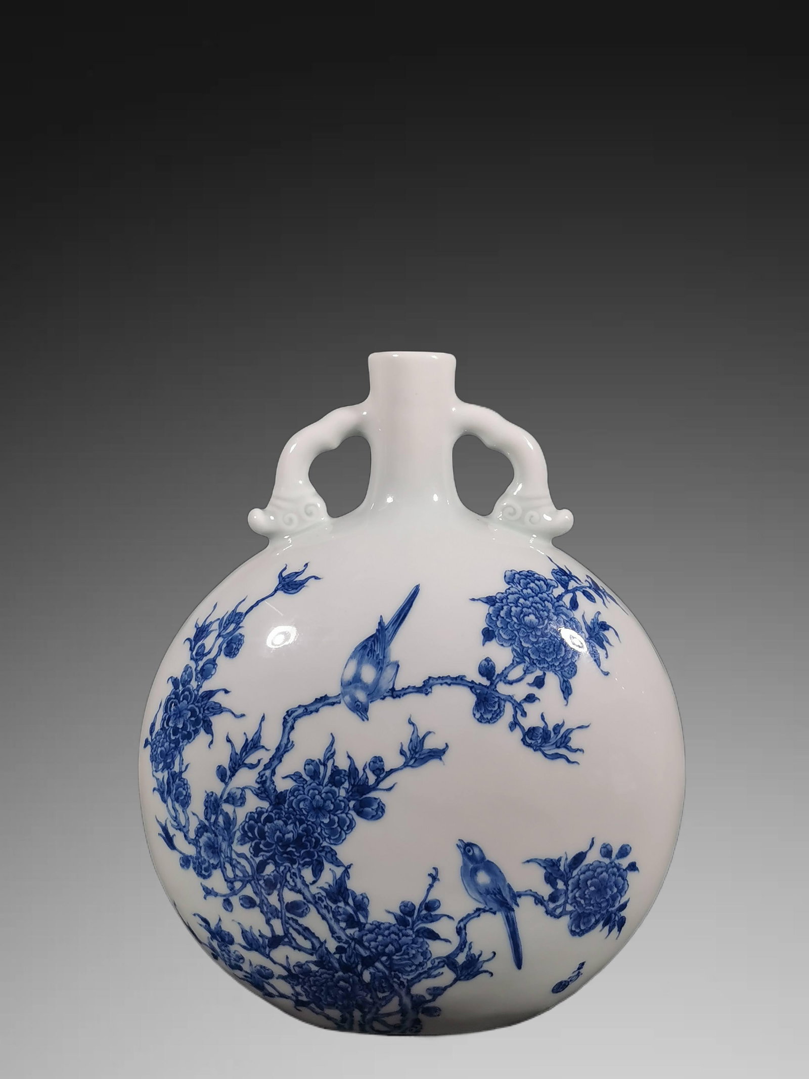 An Exquisite Blue and White Flower and Bird Pattern Vase: An Exquisite Blue and White Flower and Bird Pattern Vase,Republic of China,With Mark,Size:9.8inx8.1inx4.3in 青花花鸟纹瓶,民国,带款