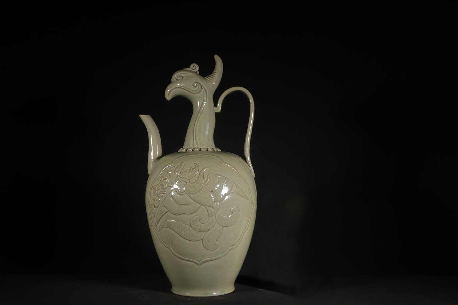 An Exquisite Yue Kiln Phoenix Pattern Phoenix Head Ewer: An Exquisite Yue Kiln Phoenix Pattern Phoenix Head Ewer,Five Dynasties,Size:13.8inx7.1in 越窑凤纹凤首壶,五代