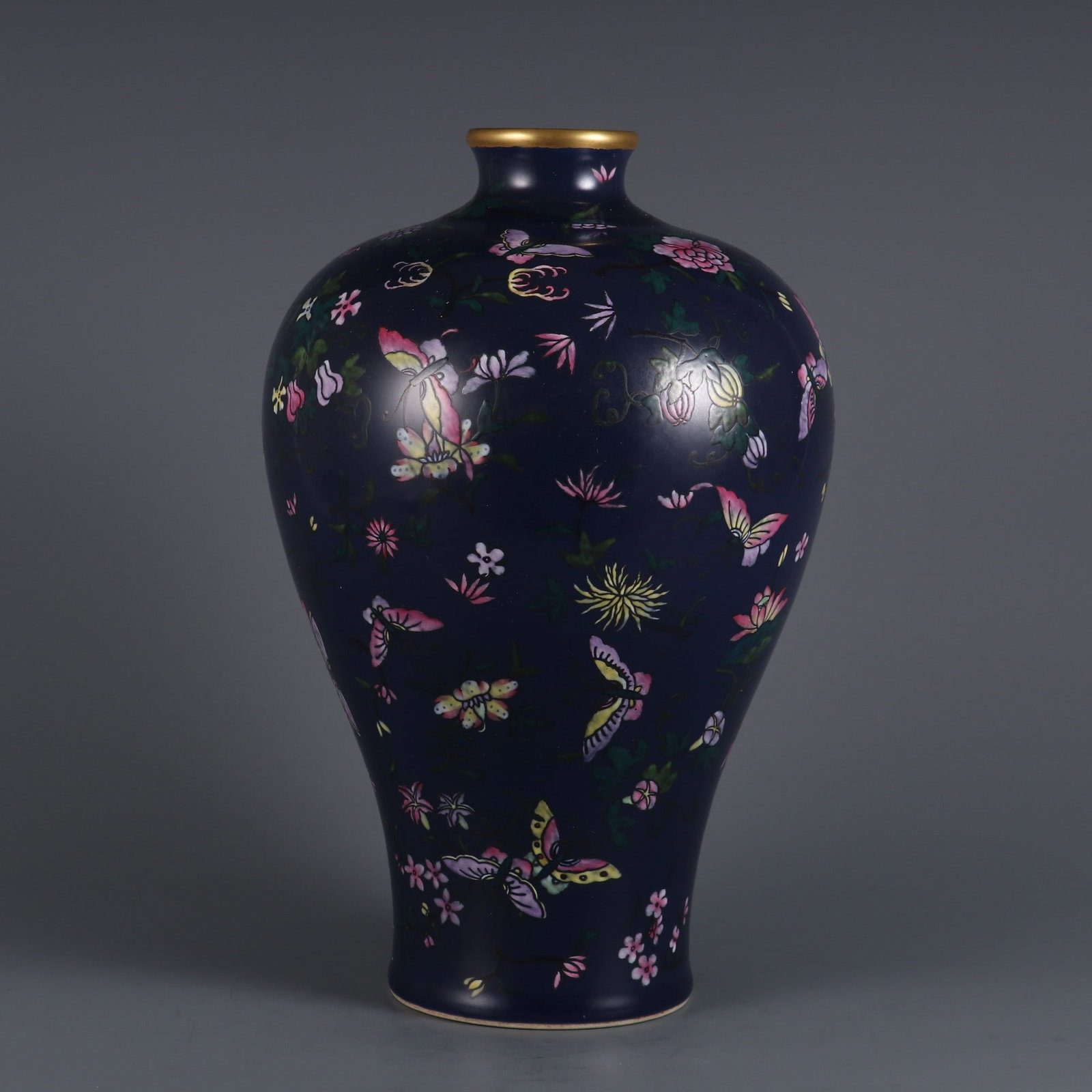 An Exquisite Ji Blue Glazed Famille-Rose Butterfly and Flower Pattern Vase: An Exquisite Ji Blue Glazed Famille-Rose Butterfly and Flower Pattern Vase,Qing Dynasty, China,Qianlong Six-character Mark,Size:11.3inx7.4in 霁蓝釉粉彩蝶恋
