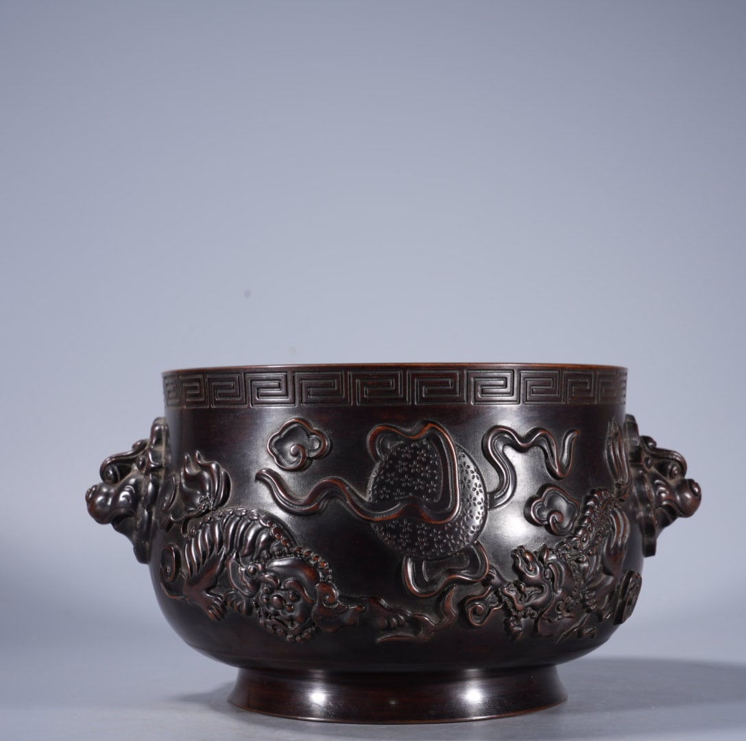 An Exquisite Bronze Relief Beast-Ears Censer: An Exquisite Bronze Relief Beast-Ears Censer,Ming Dynasty, China,With Mark,Size:4.3inx6.1in ,Weight:3350g 紫铜浮雕兽耳炉,中国明代,